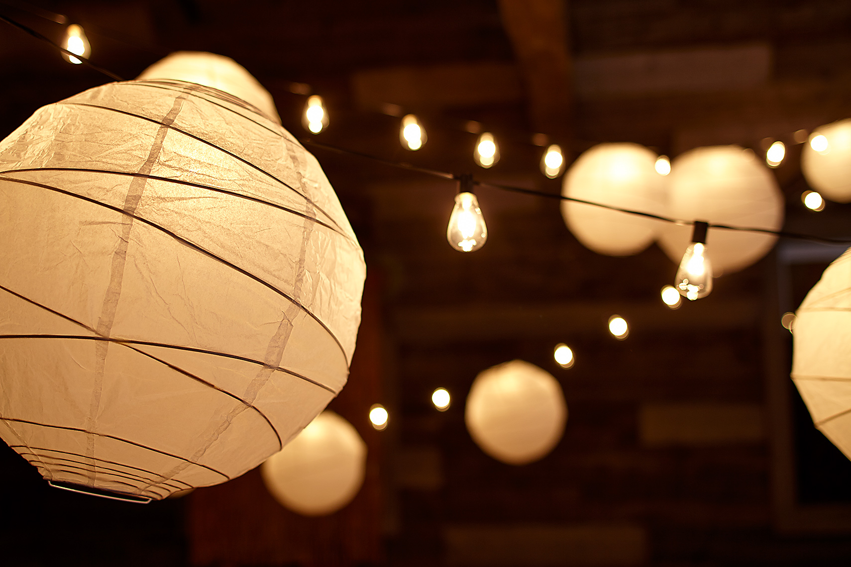 Lanterns hanging inside barn
